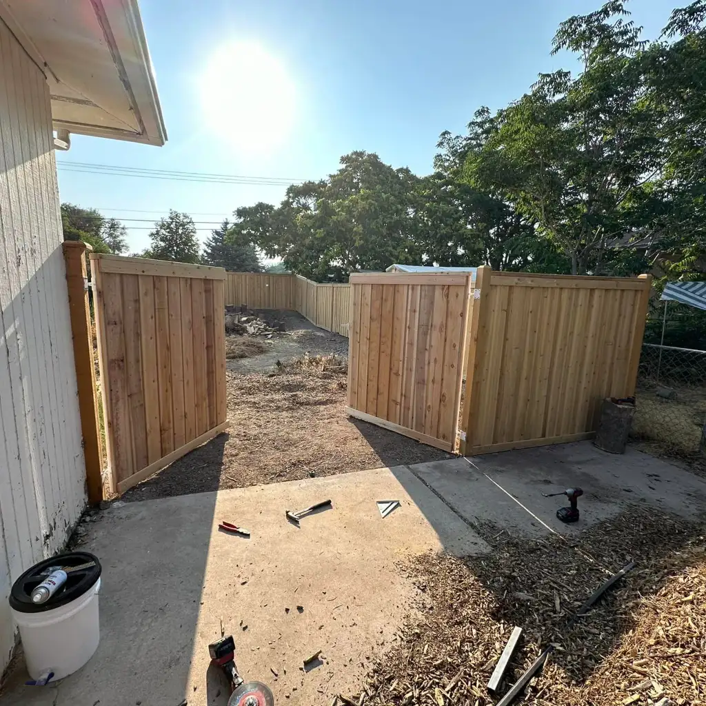 New vertical wood privacy fence installed along a Utah property